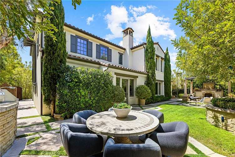 Rear elevation and stone terrace at 28 Blue Summit, Irvine